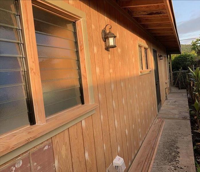 brand new wood panels on exterior wall of home