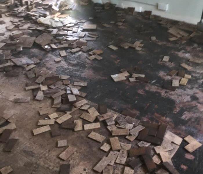 un-grouted tiles loose and scattered across floor