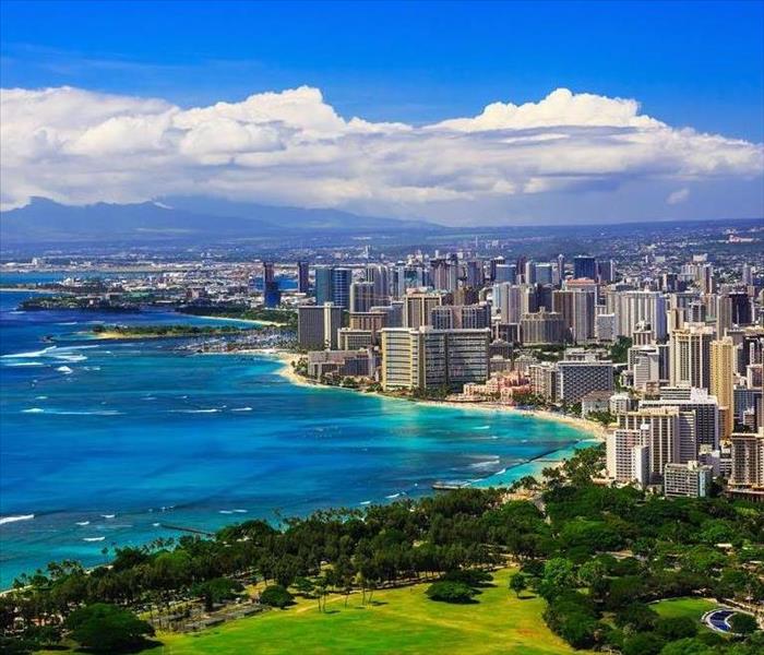 Waikiki skyline on a beautiful day with bright blue skies and seas 