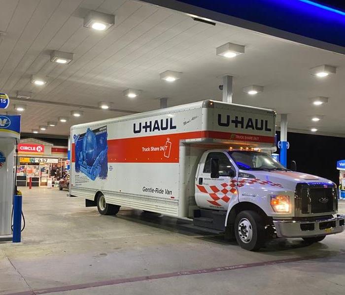 A UHAUL rental truck at a fuel station ready to make the long drive from Texas to Michigan